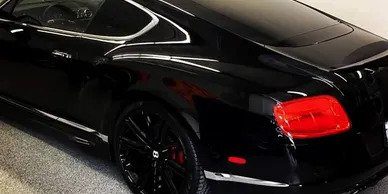 A black car with red accents on the side.